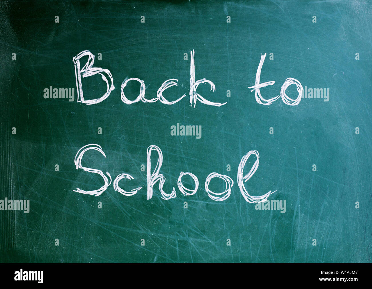 Black school chalkboard background with the inscription back to school ...