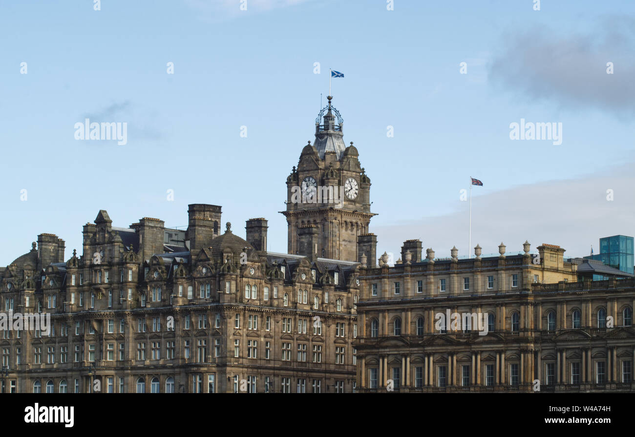 Lanscape view of the Old City of Edinburgh featuring the tower of the Balmoral Hotel on a clear day in Scotland, UK Stock Photo