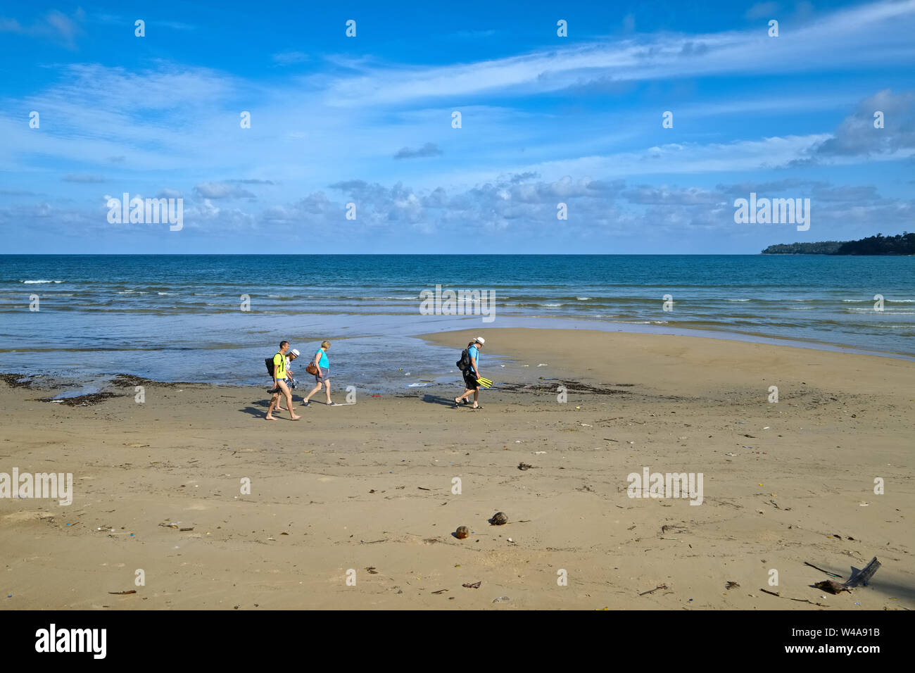 Western tourists walking along Kamala Beach, Phuket,Thailand Stock Photo