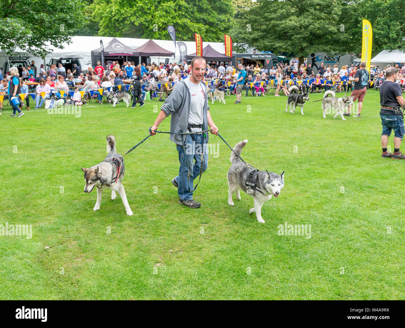 REACH sled dog rescue walk their animals around the main arena at the