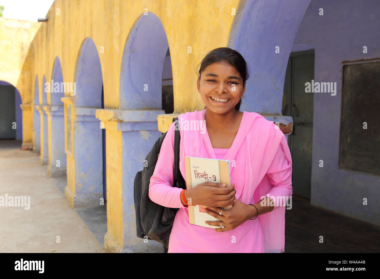 Portrait of a schoolgirl smiling Stock Photo - Alamy