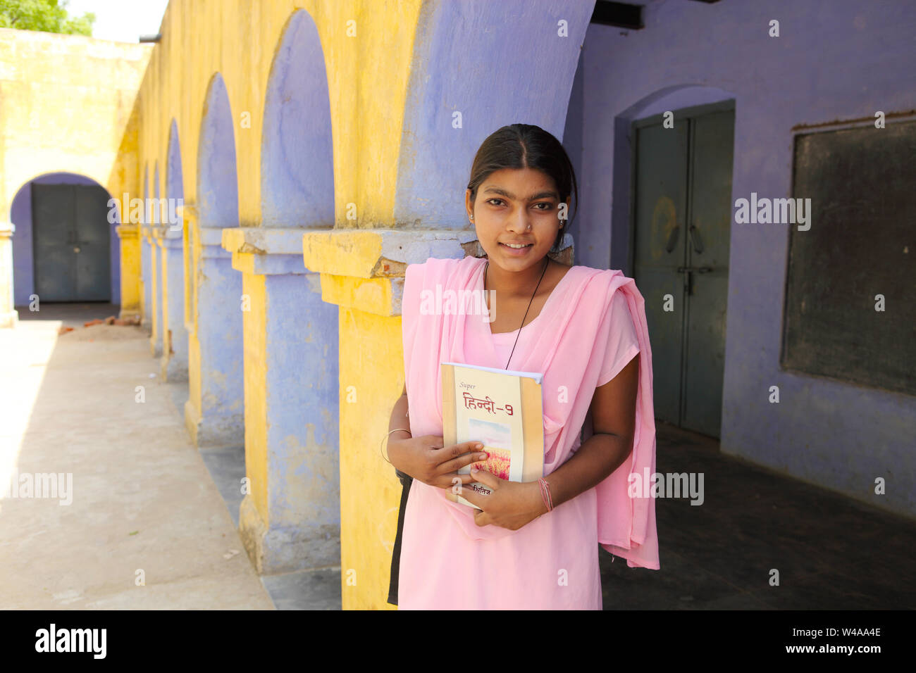 Portrait of a schoolgirl smiling Stock Photo - Alamy