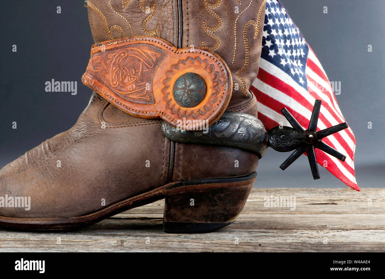 Cowboy glory with American flag and spurs. Stock Photo