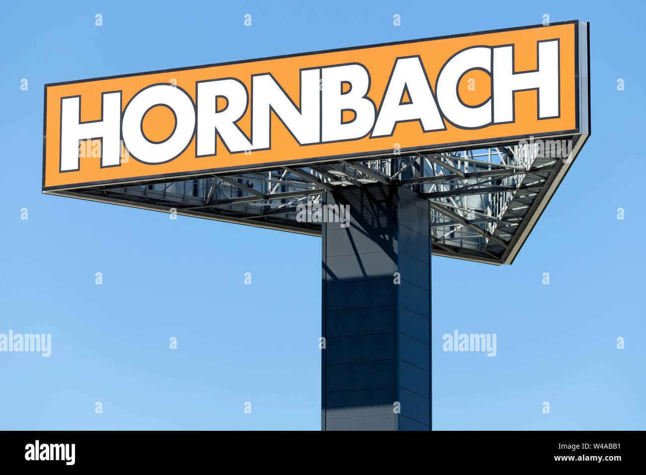 Hornbach sign against blue sky. Hornbach is a German DIY-store chain offering home improvement and do-it-yourself goods. Stock Photo