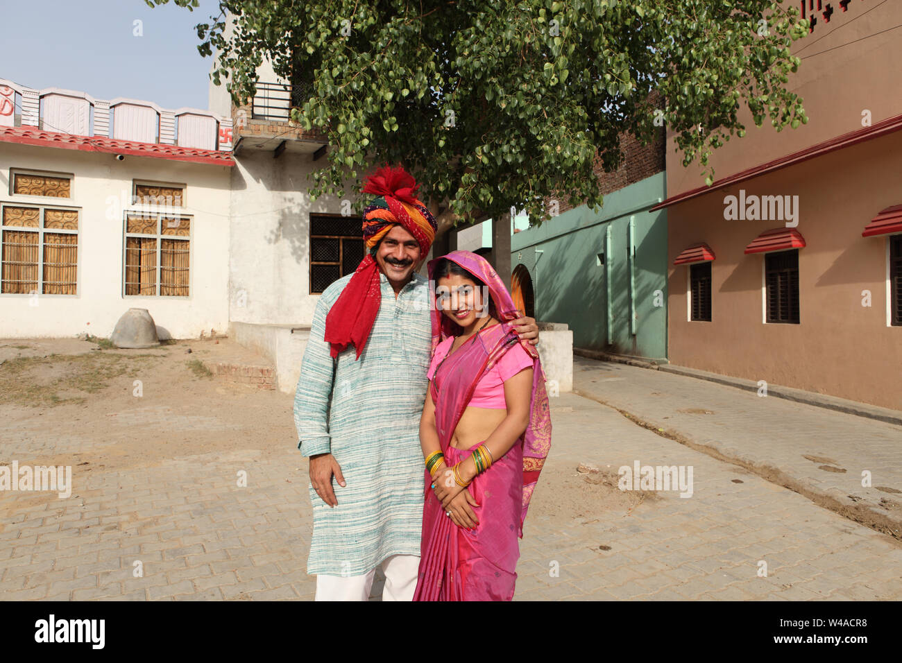 Rural couple standing together and smiling Stock Photo - Alamy