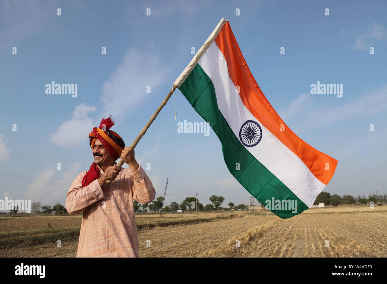 Indian farmer holding indian flag hi-res stock photography and images
