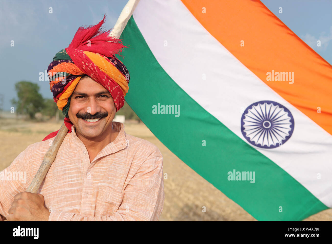 Indian farmer holding indian flag hi-res stock photography and images