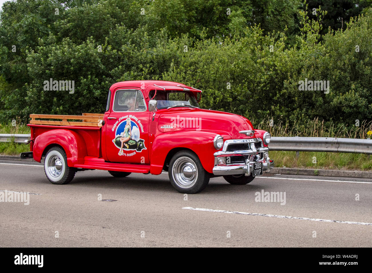 1954 50s red American Chevrolet 3900cc SUV pick up truck at the of festival of Transport held the in the seaside town of Fleetwood, Lancashire, UK Stock Photo