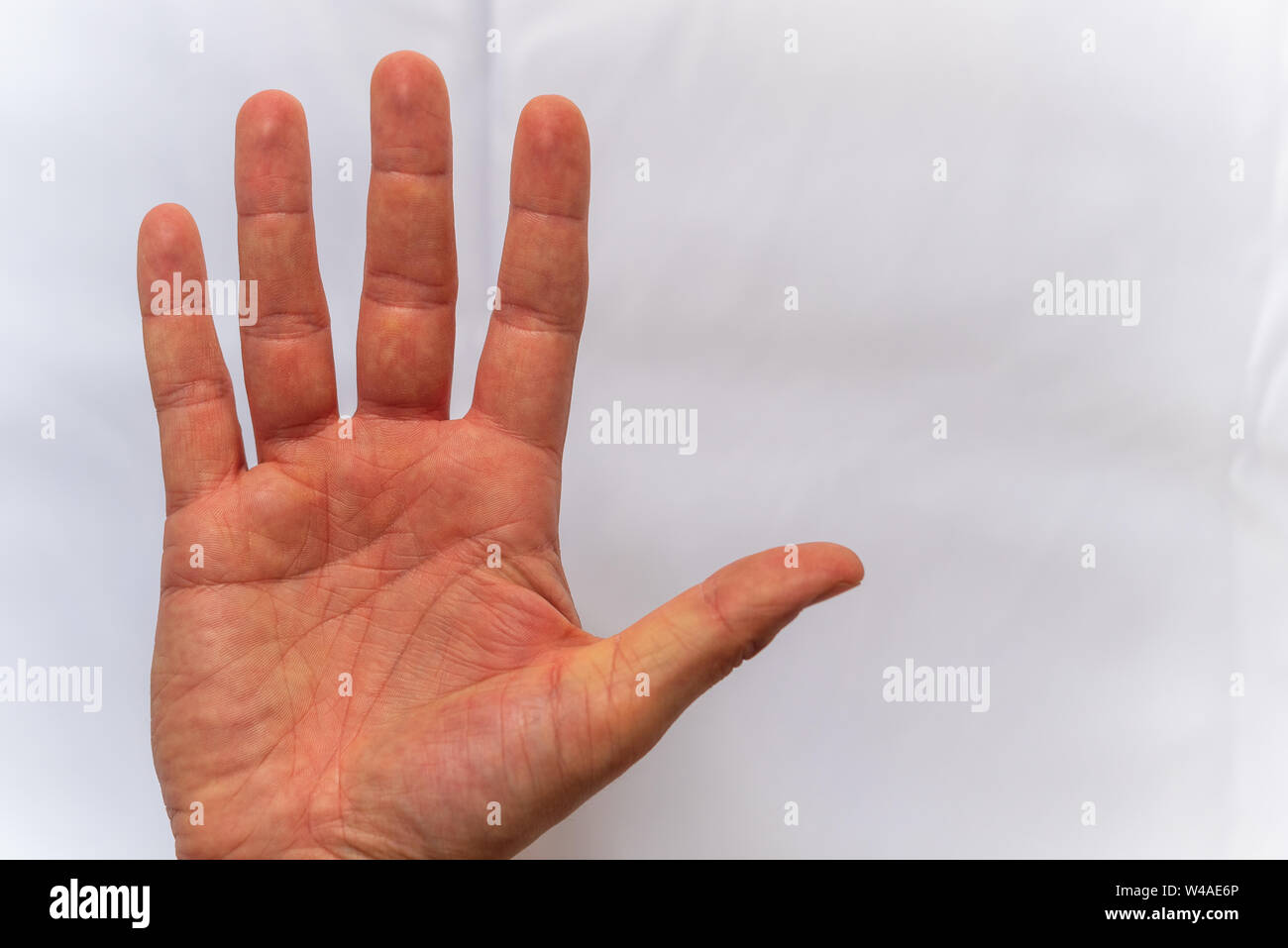 A hand shows different signs on white background Stock Photo