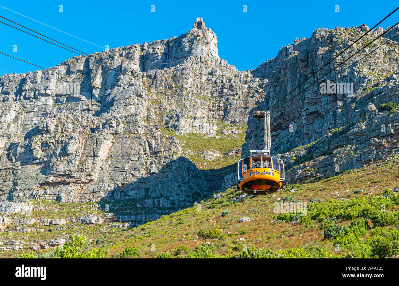 A cable car with tourists climbing up to the Table Mountain national park, Cape Town, South Africa. Stock Photo