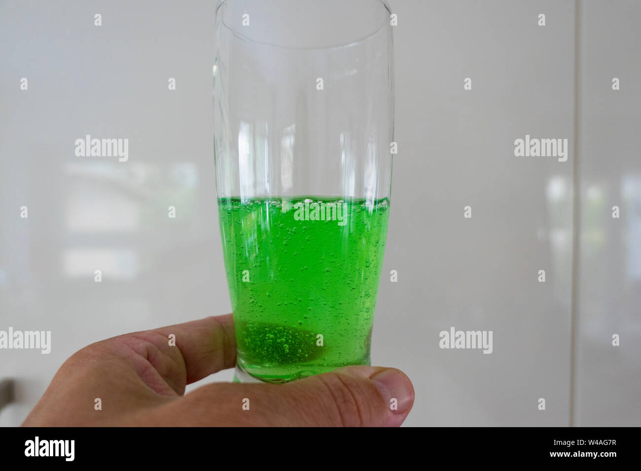 Green Viscous Liquid In The Glass With Hand Stock Photo Alamy Green Viscous Liquid In The Glass With Hand Stock Photo Alamy