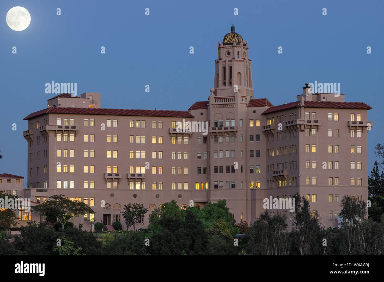 Richard H. Chambers Courthouse in Pasadena, California. One shot for the building and one for the moon merged. The position of the moon is correct. Stock Photo