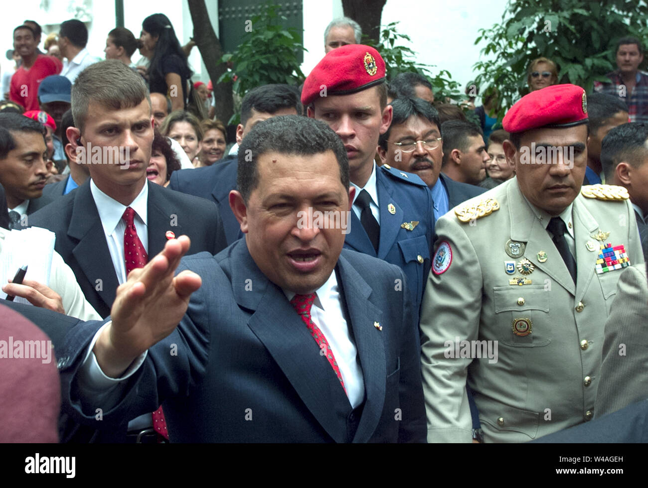 Venezuelan President Hugo Chavez salutes surrounded by military members in Caracas, Venezuela Stock Photo