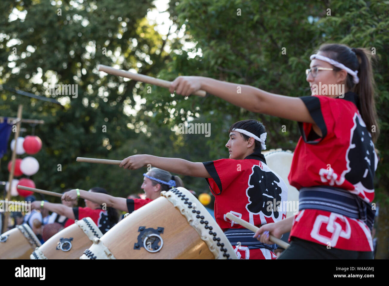Seattle Matsuri Taiko drum ensemble performs at the 87th annual Bon Odori Festival in Seattle, Washington on July 20, 2019. The lively summer festival includes traditional music and folk dance to welcome the spirits of the dead and celebrate the lives of ancestors. Stock Photo