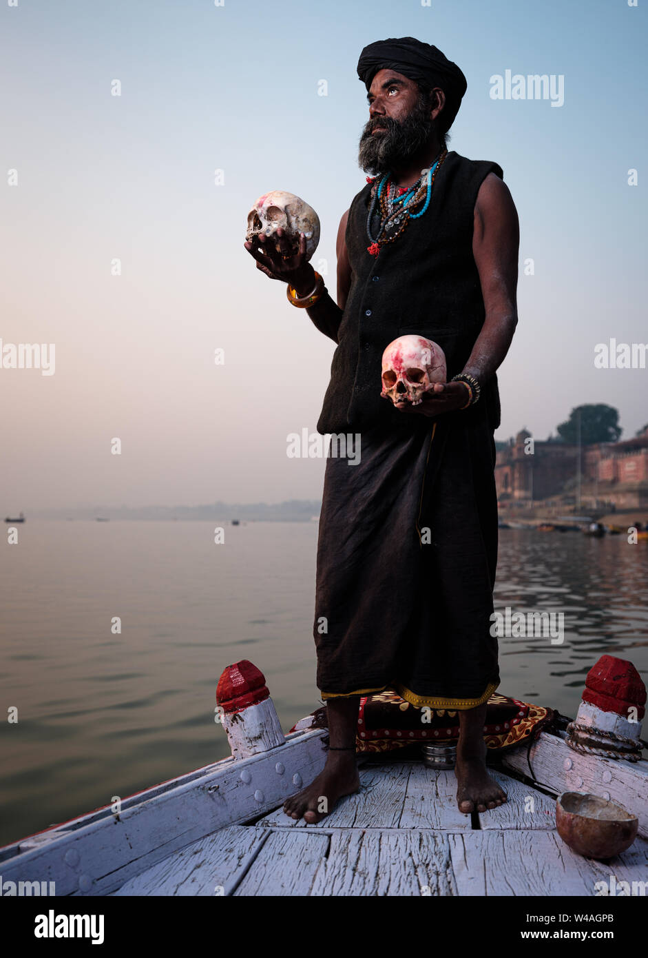 Varanasi, INDIA - CIRCA NOVEMBER 2018: Portrait of a Aghori with skull in Varanasi. The Aghoris are a small group of ascetic Shaiva sadhus. They engag Stock Photo