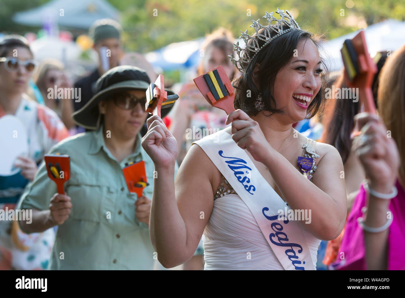 Caroline Pham, former Miss Seafair 2000, performs a Bon dance with kachi-kachi at the 87th annual Bon Odori Festival in Seattle, Washington on July 20, 2019. The lively summer festival features traditional music and folk dance to welcome the spirits of the dead and celebrate the lives of ancestors. Stock Photo