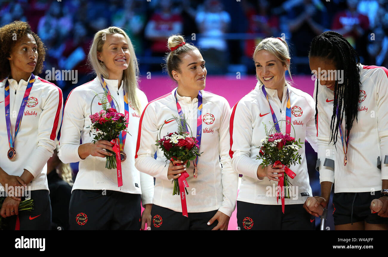 England players celebrate with their bronze medals after finishing