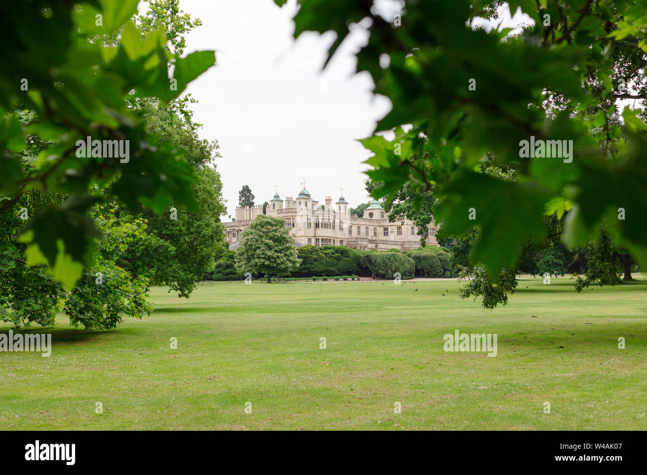 Front facade view through the tree of Audley End House, Saffron Walden