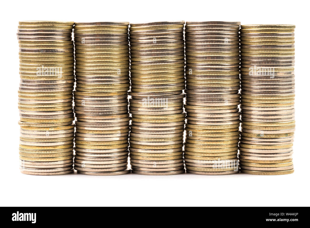 Five equal stacks of coins merged in one wall isolated on white background. Symbol of annuity or flat level. Stock Photo