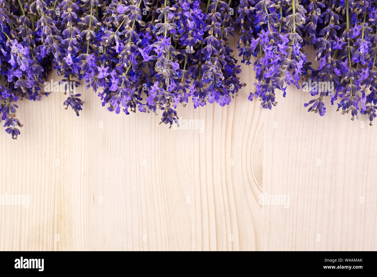 Flowers background. Frame pattern of lavender flowers on wooden background.  top view. copy space Stock Photo - Alamy