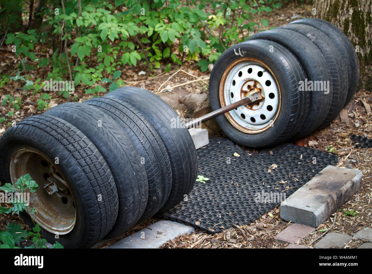 Homemade punching bag made from old car tires fastened with steel  reinforcement. punching bag Stock Photo - Alamy