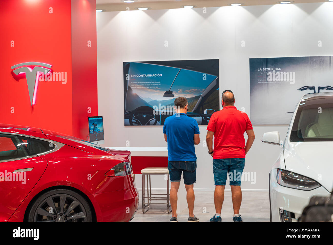 Valencia, Spain July 21, 2019 Two buyers of a Tesla Model S electric