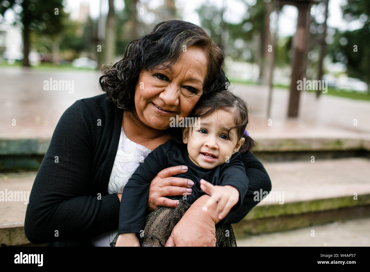 Grandmother & grand daughter hugging Stock Photo