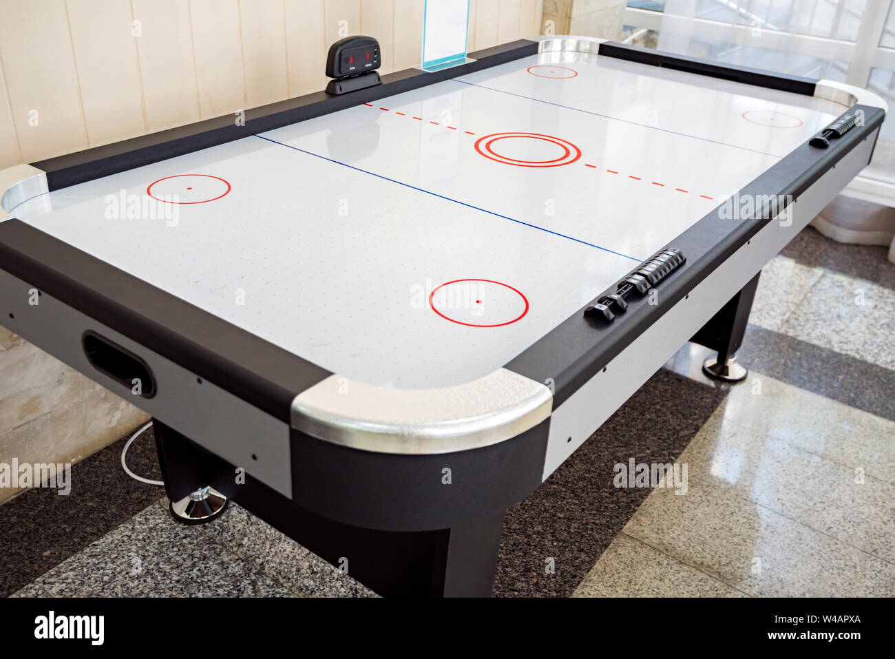 Close up empty air hockey table for playing indoors Stock Photo