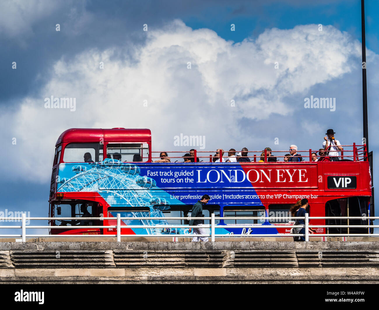 London Tourist Bus - an Open Top London Tourist bus crosses Waterloo Bridge over the River Thames Stock Photo