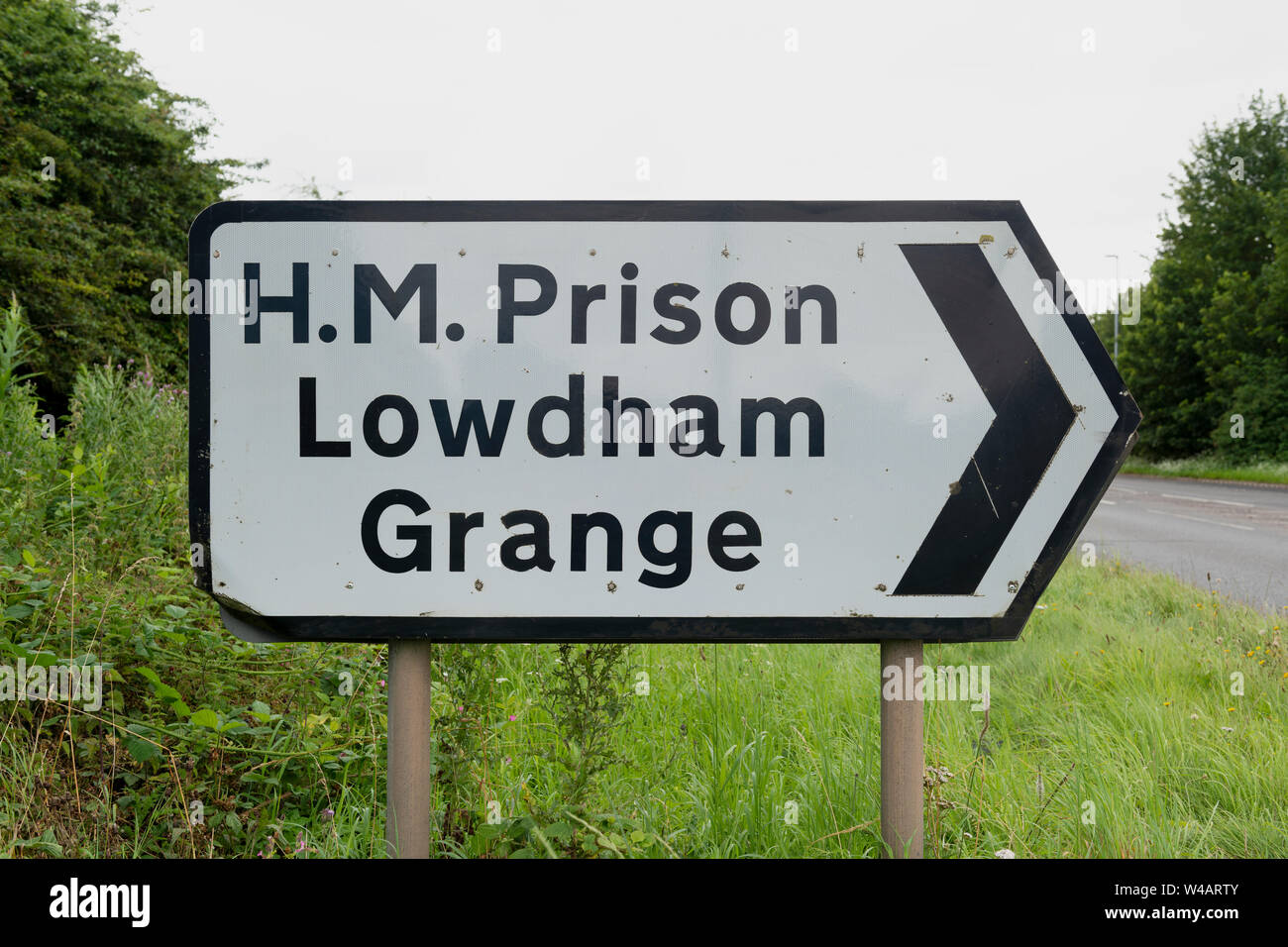 A roadsign for HMP Lowdham Grange category B men's prison in Nottinghamshire, UK. Stock Photo