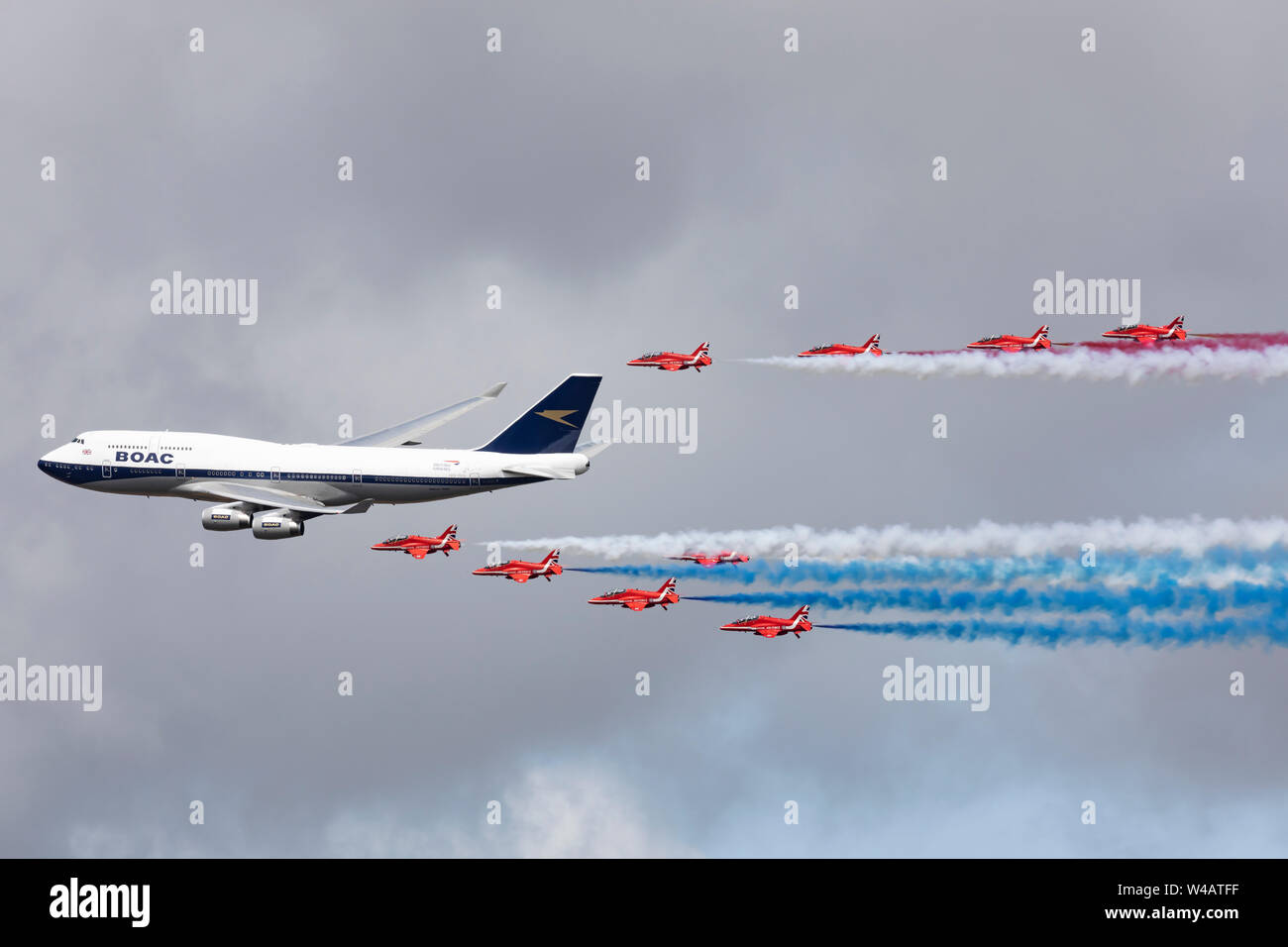 Red Arrows formation flight with British Airways BOAC livery Boeing 747 flying on July 20th 2019 at RIAT 2019, RAF Fairford, Gloucestershire, UK Stock Photo