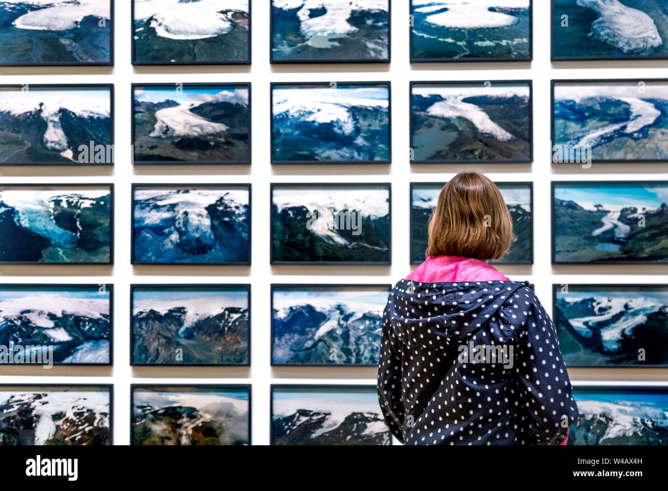 Woman looking at The Glacier Series, 1999, Olafur Eliasson 'In Real Life' 2019 exhibition at the Tate Modern, London, UK Stock Photo
