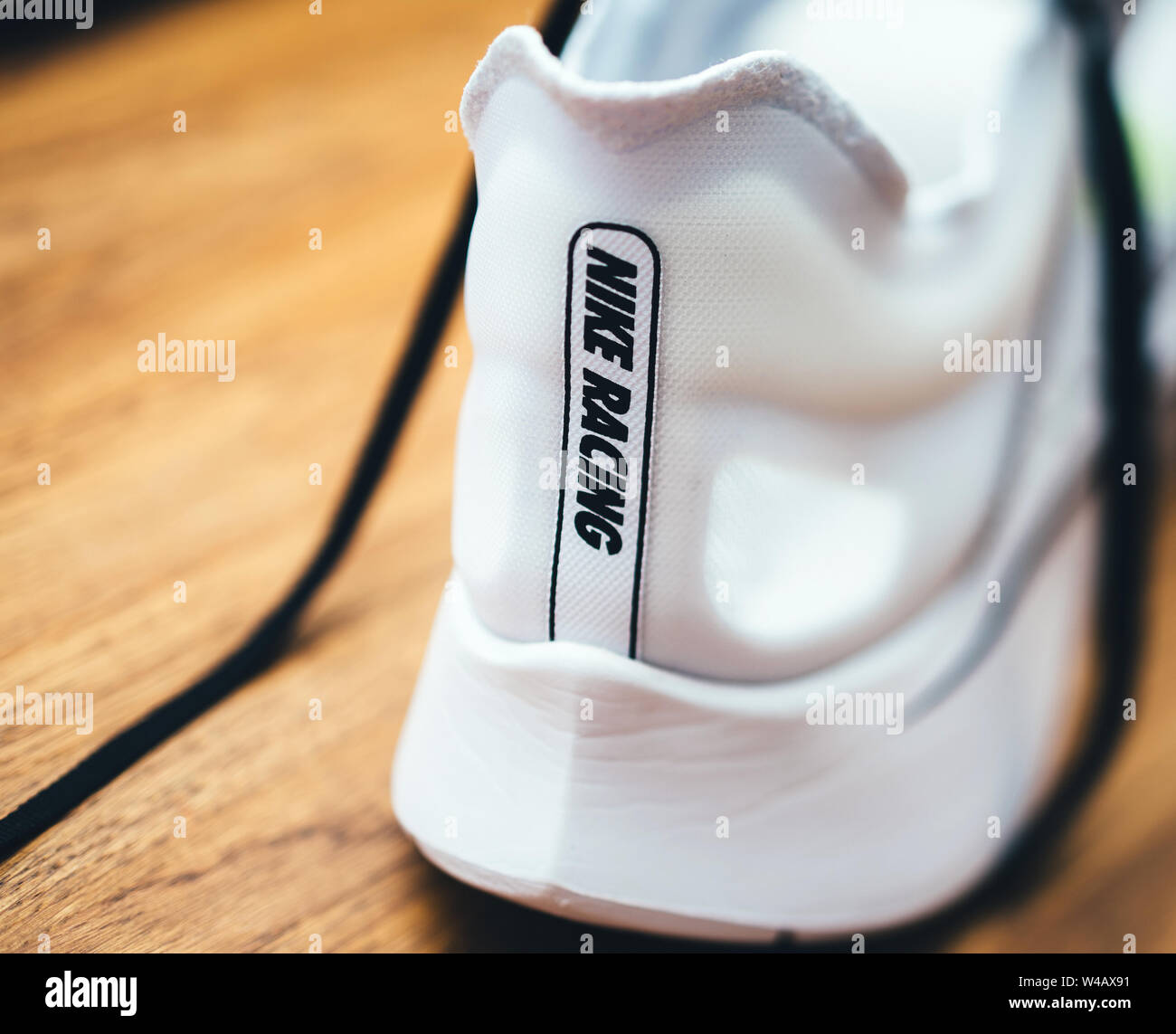Paris, France - Jul 8, 2019: Macro rear view of new Nike Zoom Fly SP Fast  running shoes on wooden table - includes the Nike Racing logotype insignia  Stock Photo - Alamy