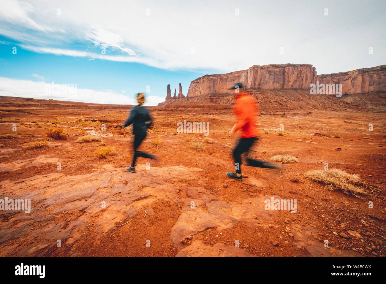 Couple Trail Running Monument Valley Red Dirt Stock Photo
