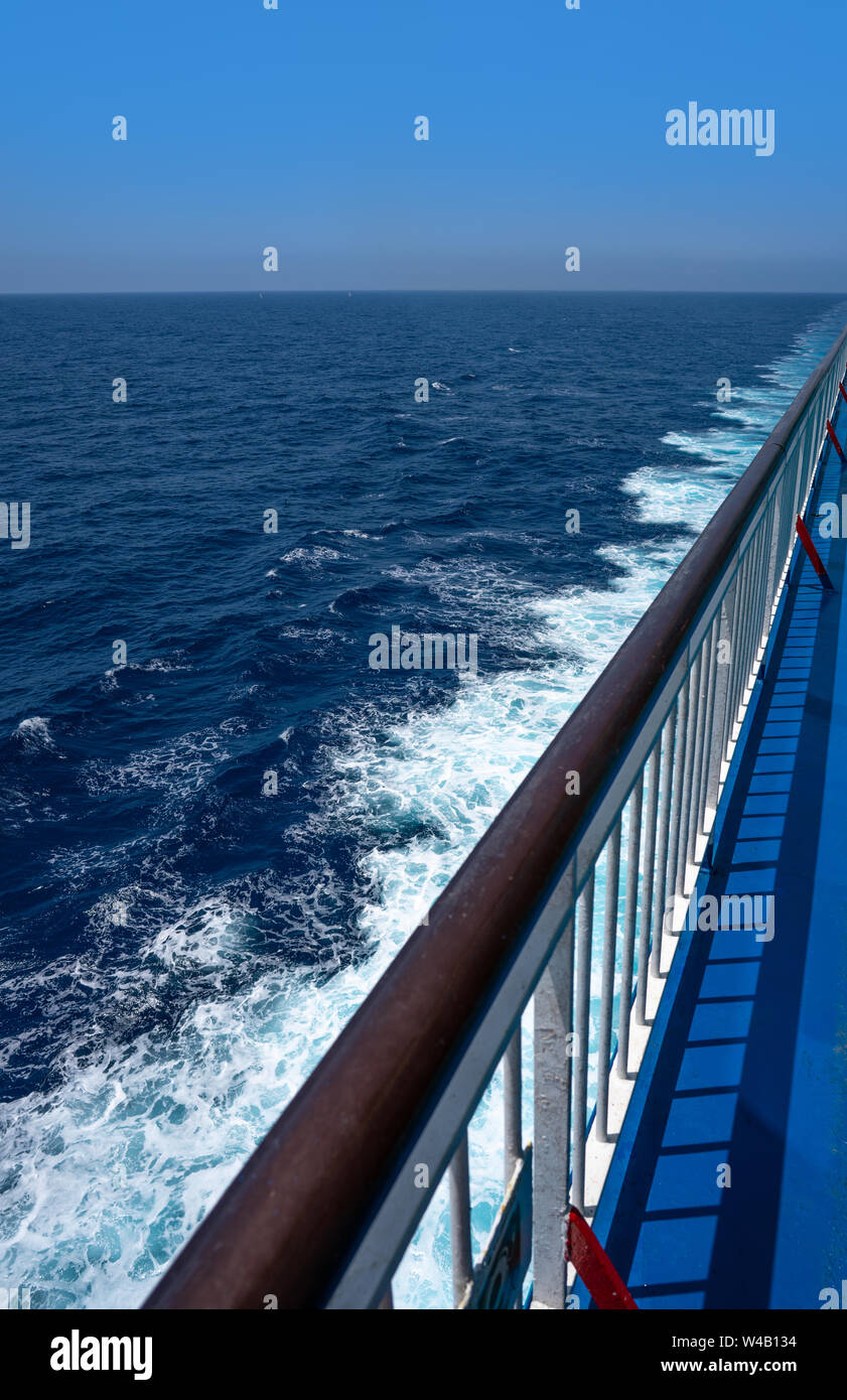 Ferry cruise railing in a blue Mediterranean sea ocean Stock Photo
