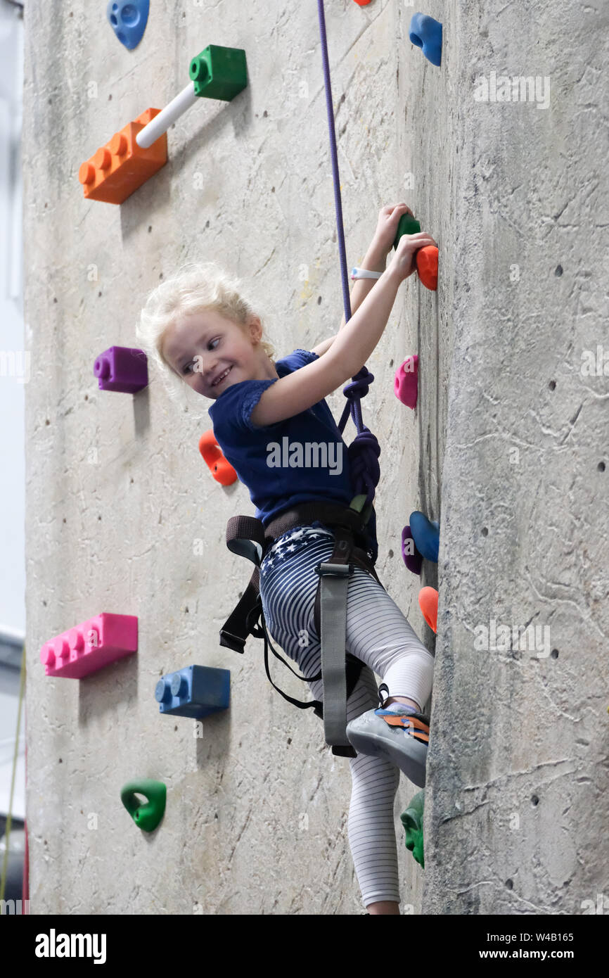Girl rock climbing wall hires stock photography and images Alamy