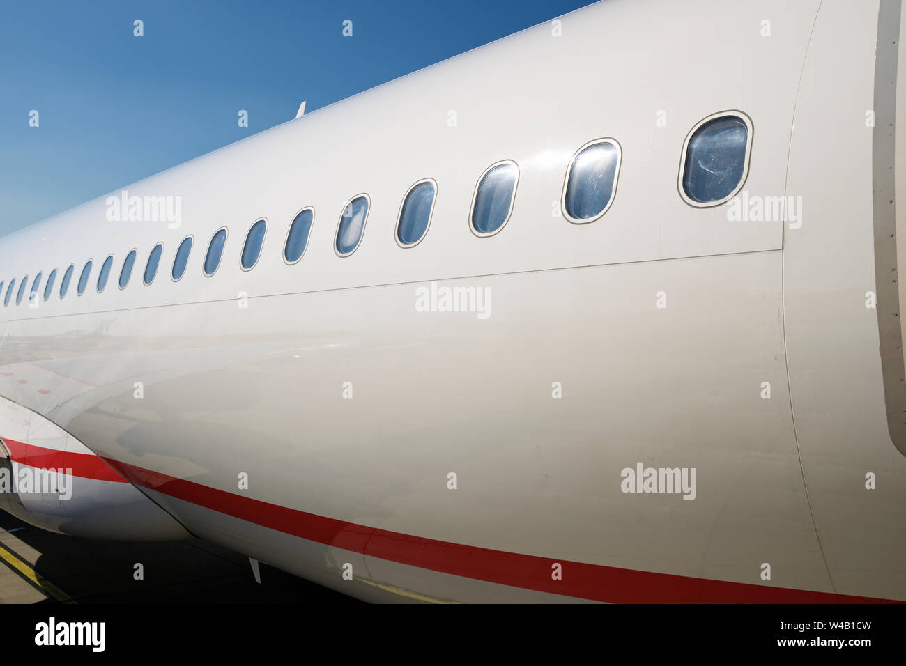Windows of a passenger plane ready to take off. Stock Photo