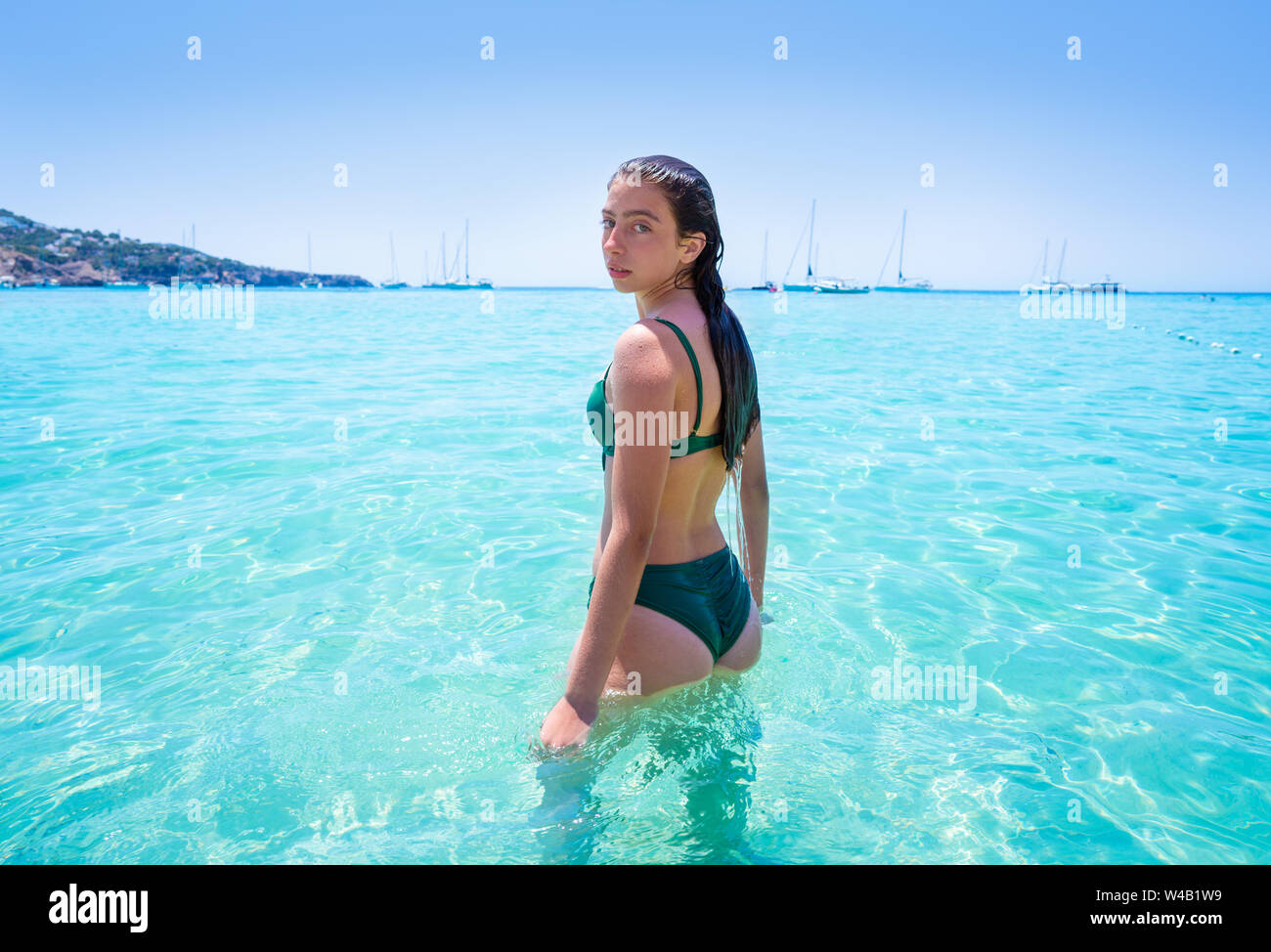 Unarmed warm Wink Ibiza bikini girl relaxed in clear water beach of Balearic Islands Stock  Photo - Alamy