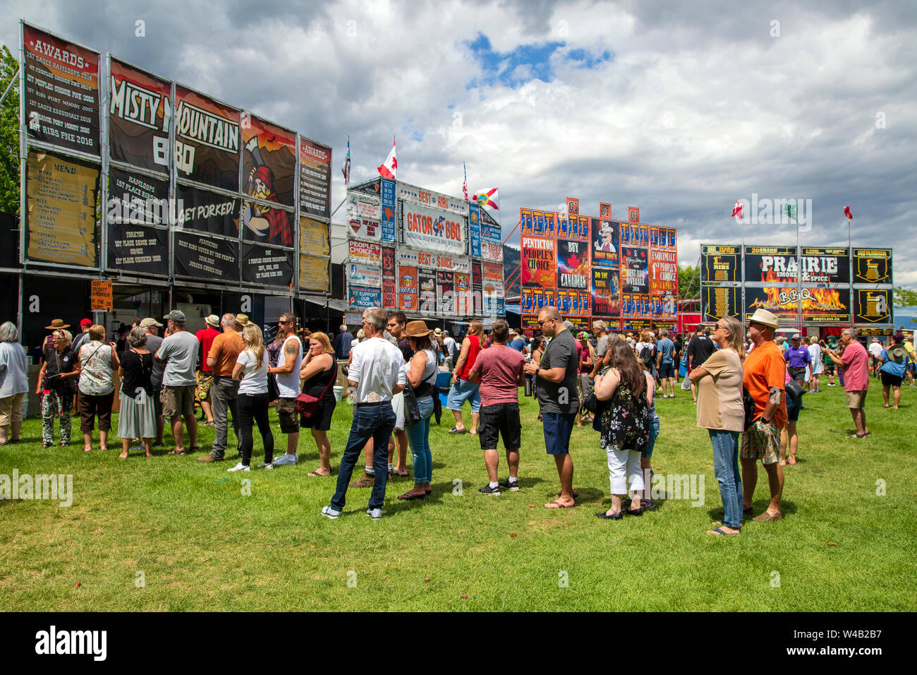 June 29, 2019 - Penticton, British Columbia, Canada: Patrons standing in line to order pork ribs and beef ribs at the annual Penticton Rotary Ribfest Stock Photo