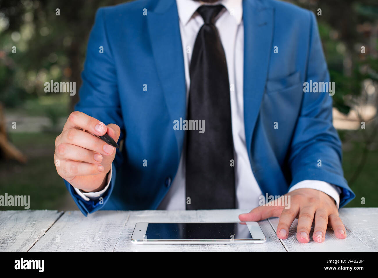 Professional hand points pen hi-res stock photography and images - Alamy