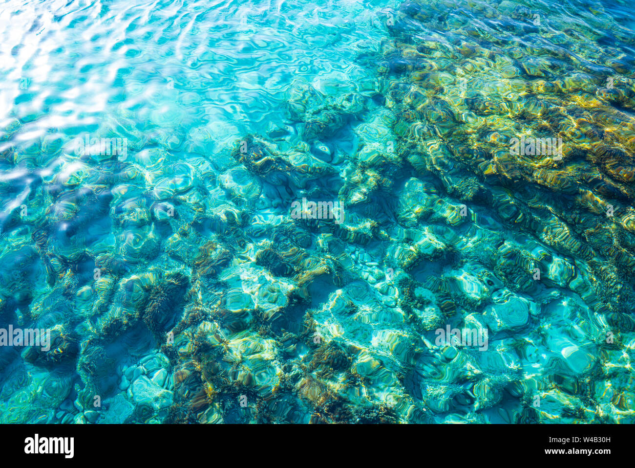 Ibiza Portinatx Arenal Gran beach in Balearic Islands clear water detail Stock Photo