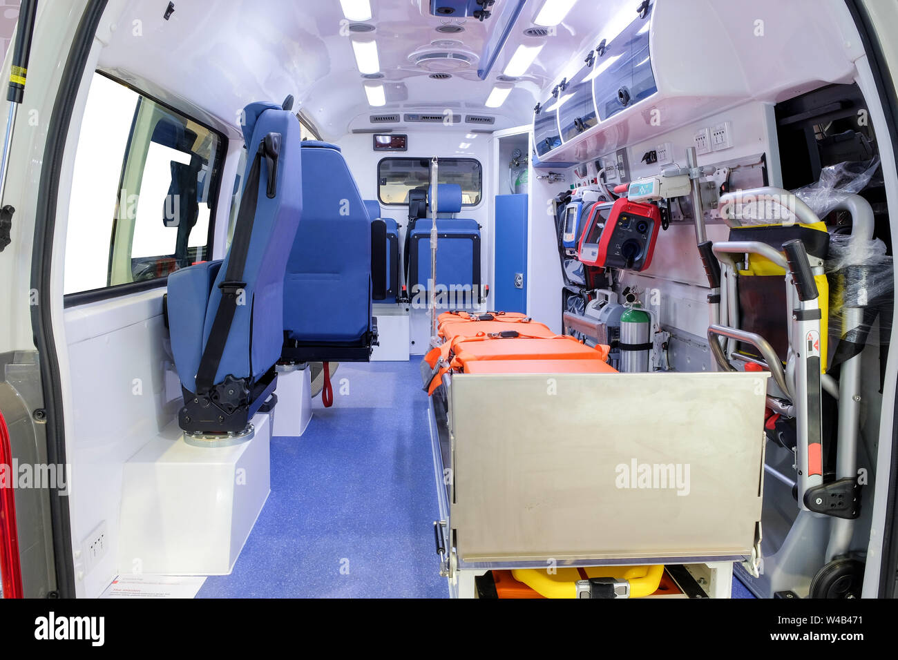 Inside an ambulance car with medical equipment for helping patients before delivery to the hospital. Stock Photo