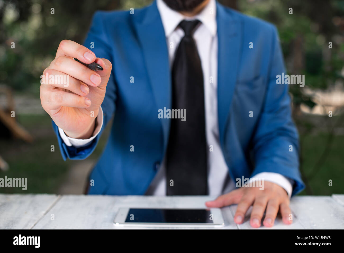 Professional hand points pen hi-res stock photography and images - Alamy