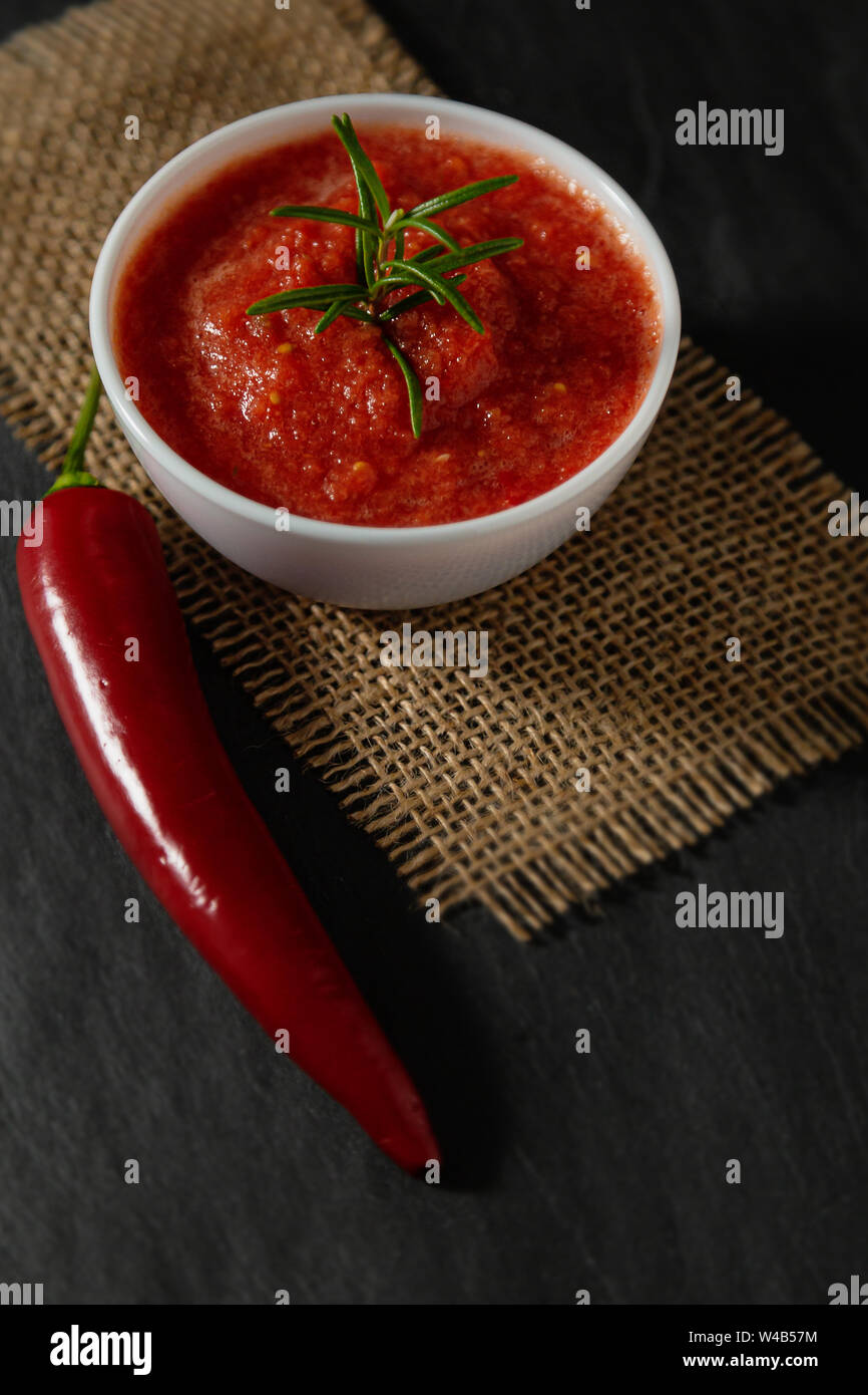 Traditional Maghrebi hot chili pepper sauce paste harissa. Tunisia and Arabic cuisine adjika