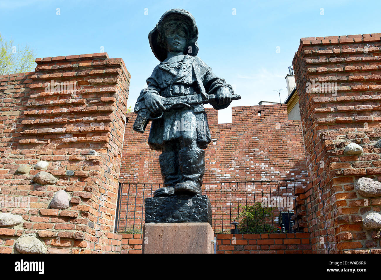 WARSAW, POLAND - 16 APRIL 2019: Statue 'the little insurgent' with helmet and gun commemorates children who served as runners in the Warsaw Uprising. Stock Photo