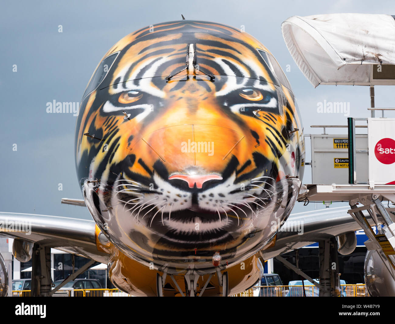 Singapore - February 4, 2018: Embraer E190-E2, with the front section decorated as a tiger head, on display during Singapore Airshow at Changi Exhibit Stock Photo