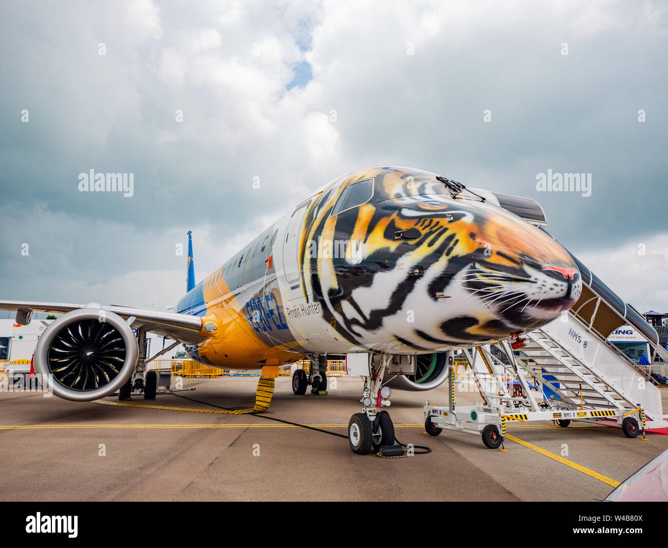 Singapore - February 4, 2018: Embraer E190-E2, with the front section decorated as a tiger head, on display during Singapore Airshow at Changi Exhibit Stock Photo