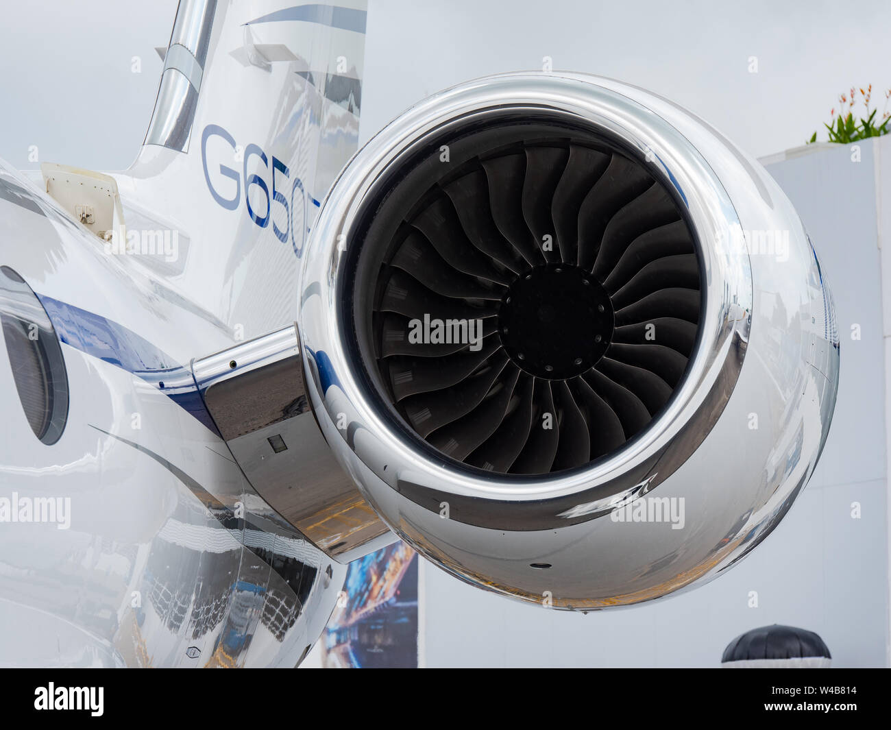 Singapore - February 4, 2018: Tail plane and engine of Gulfstream G650ER business jet on display during Singapore Airshow at Changi Exhibition Centre Stock Photo