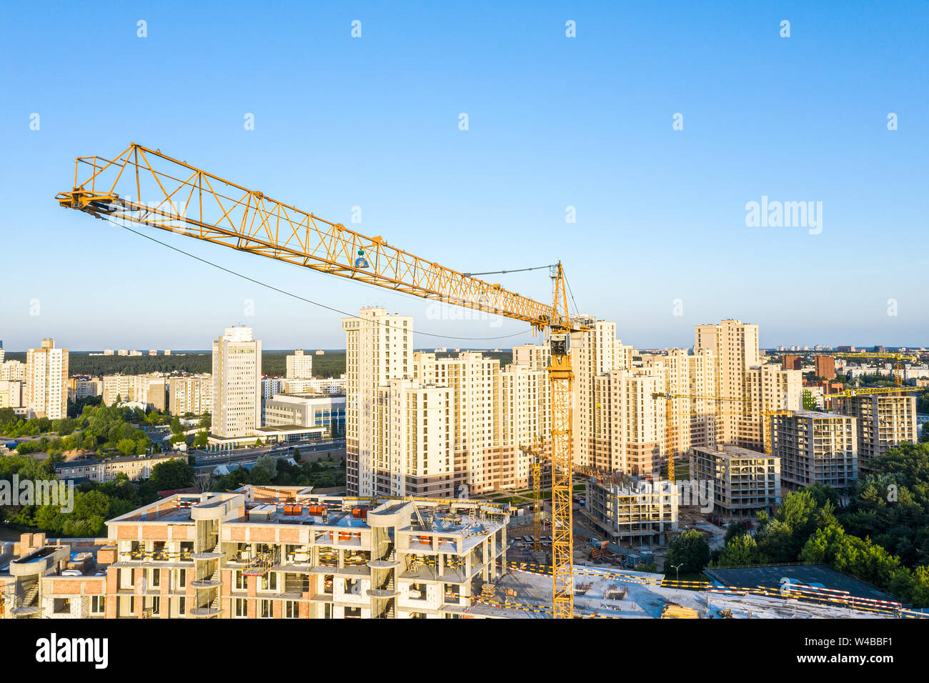 aerial panoramic view of newly built apartment building. yellow tower ...