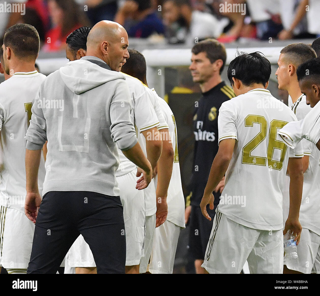 Madrid head coach Zinedine Zidane talks to Takefusa Kubo (26 )of